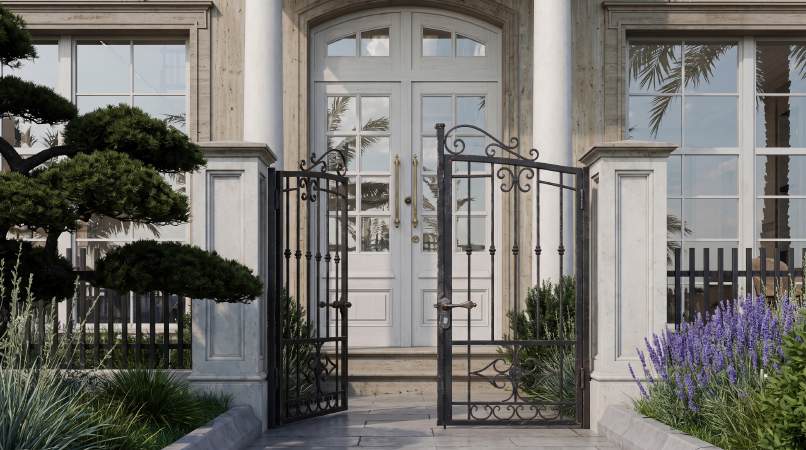 Wrought iron gate and white columns at Villa Type D